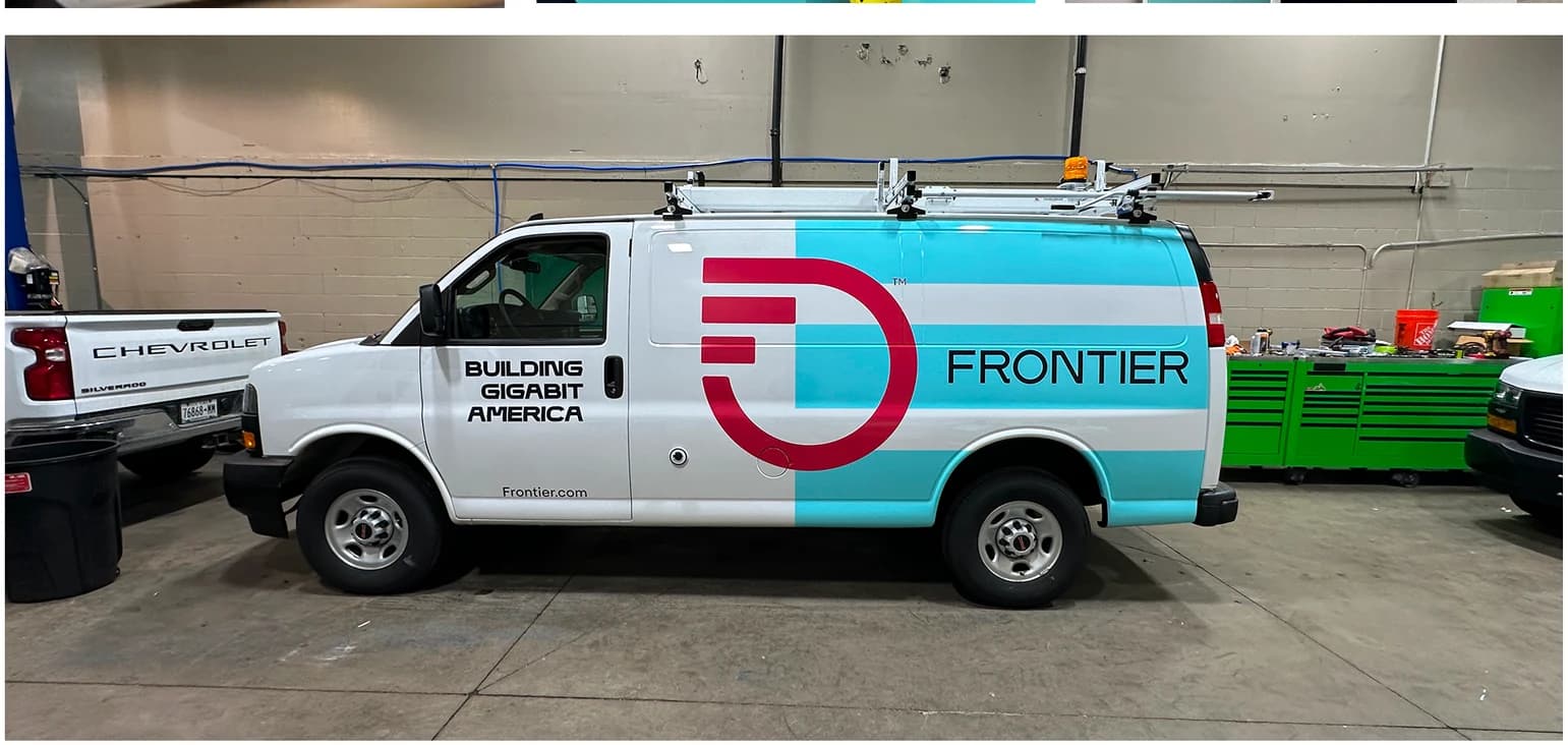 Finished Frontier service van with fleet vinyl graphics installed in shop by ninety two